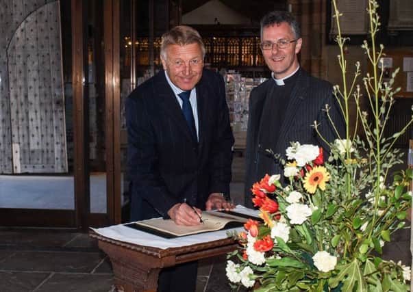 The Lord-Lieutenant of North Yorkshire, Barry Dodd, and the Dean of Ripon, the Very Rev John Dobson, sign the celebratory Queens Birthday Book in Ripon Cathedral.