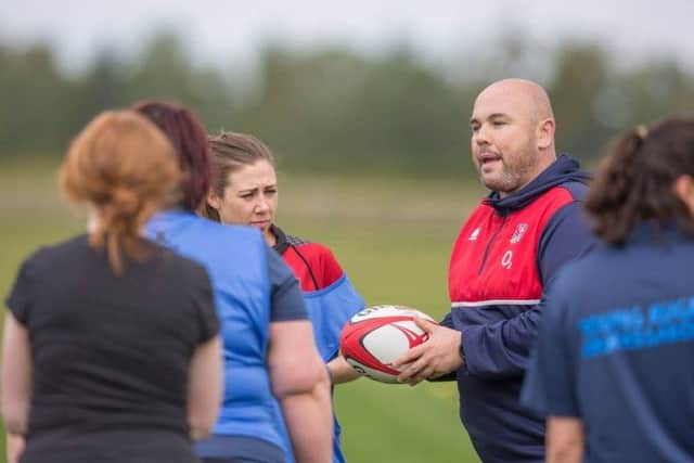 England coach Matt Ferguson with some of the ladies players