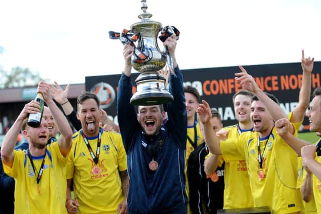Parker lifted the National League North play-off trophy to take Guiseley into the National League Premier in 2015.