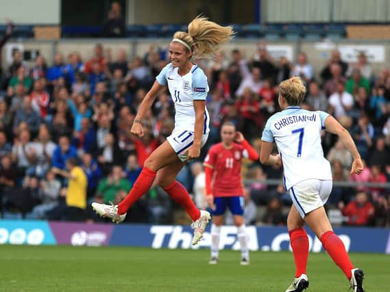 Rachel Daly celebrates scoring England's third against Serbia
