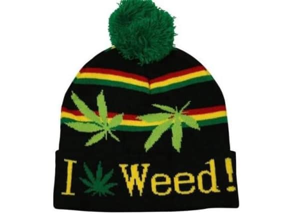 The officer is accused of wearing a hat with 'I love weed@ written on it