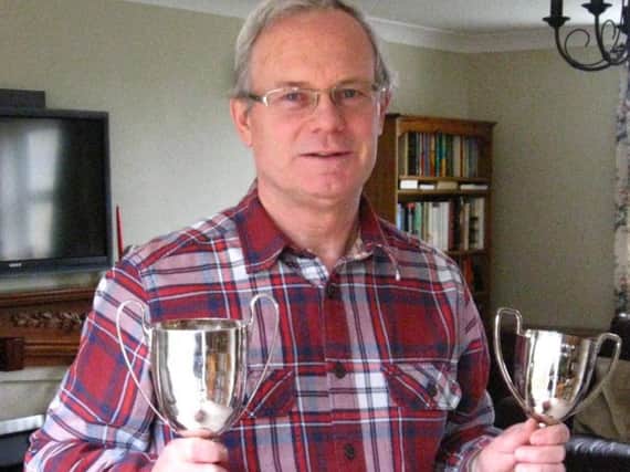 Writer/director Keith Burton with the cups he won for his pay The Journey at the 2013 Nidderdale One-Act Play Festival.