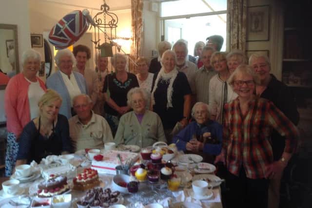 Birthday girl Bessie Brooke surrounded by friends from Spofforth Senior Moments Travel Club.