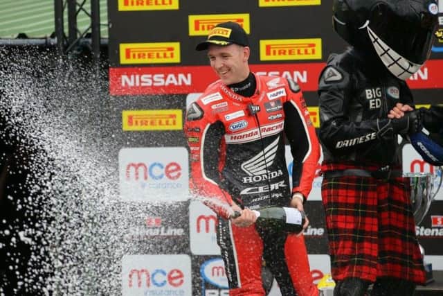 Linfoot sprays the champagne after his second place at Knockhill