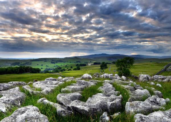 A Yorkshire scene: Looking across to Ingleborough from the limestone outcrops above Stainforth as the sun goes down. Picture: Bruce Rollinson