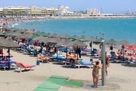 getting away from it all: Families wont cut back on the summer holidays despite a survey showing expectations for spending prospects had fallen. Picture:  Niall Carson/PA Wire