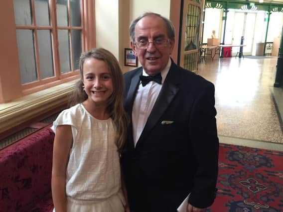 Young singer Capri Everitt with  Ian Smith, the founder of the Gilbert and Sullivan International Festival inside the Royal Hall in Harrogate.