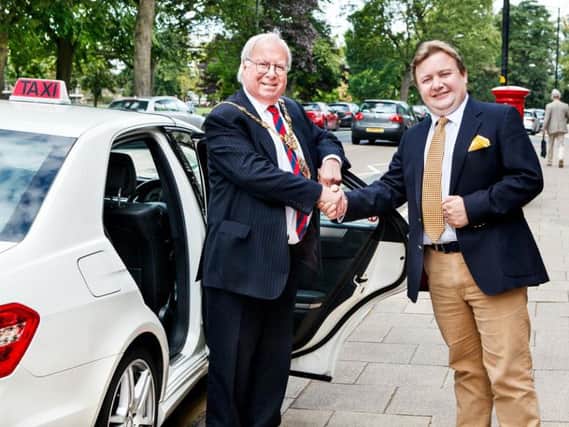 The Mayor of Harrogate, Coun Nick Brown, welcomes the taxi initiative set up at the West Park Hotel by Provenance Inns director, Michael Ibbotson.