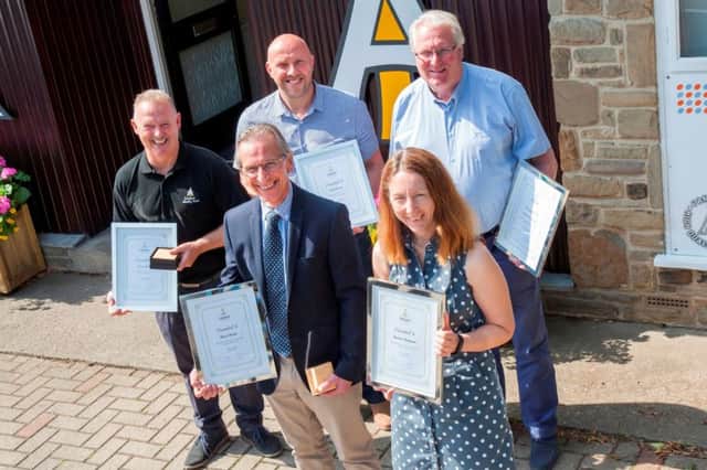 (Back) Kevin Jones, Paul Morris, Howard Jackson; (front) Barry Shield and Sharon Chapman.