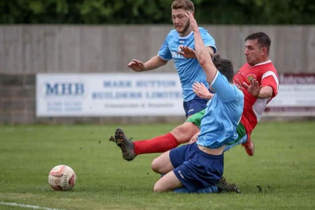 New Harrogate Railway player-boss Paul Beesley netted a late goal to earn his side a point at Barton Town. Picture: Caught Light Photography