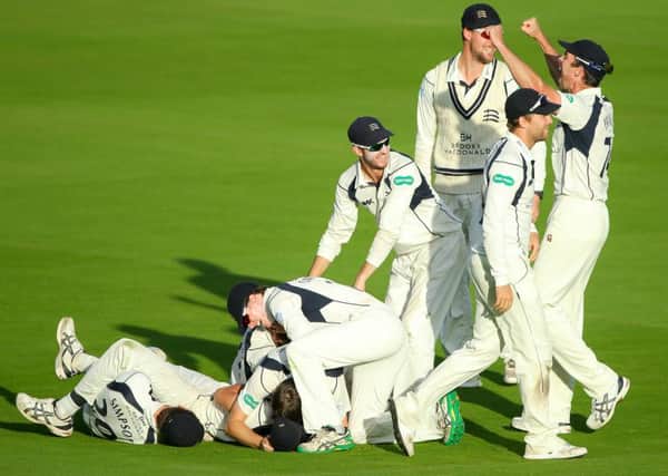 Middlesex's Toby Roland-Jones celebrates with his team-mates after taking a hat-trick of wickets to win the County Championship. Picture by Alex Whitehead/SWpix.com