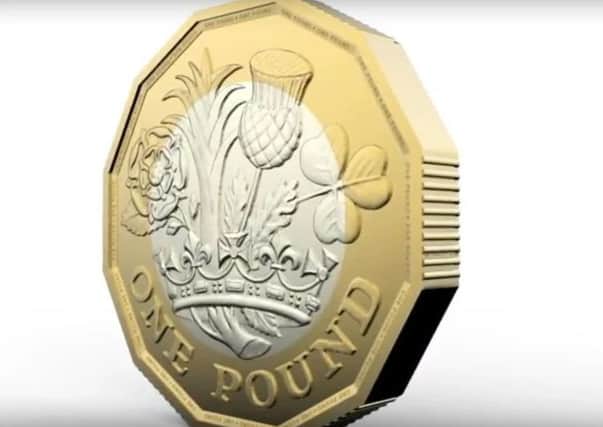 The new pound coin will come into circulation in March next year.