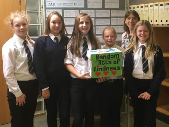 Random Acts of Kindness month in Oatlands area - St Aidan's High School English teacher Mrs Shores with some of the pupils and their RAK box and their pledge board.