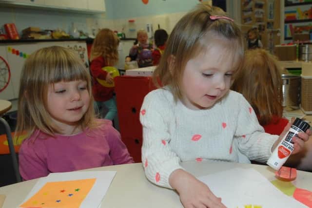 Macey does some arts and crafts at nursery with one of her friends. Picture: Adrian Murray