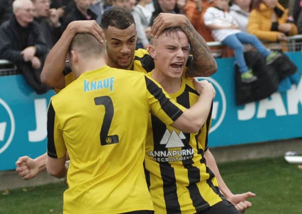 Warren Burrell, centre, was on target for Harrogate Town in their defeat to Tamworth