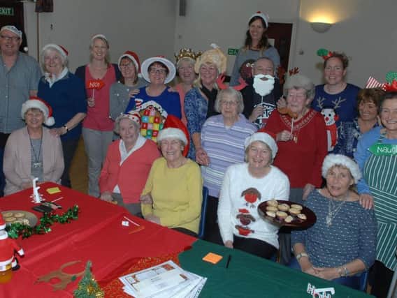 Attendees of Dementia Forward's wellbeing caf enjoy sharing memories over a mince pie.