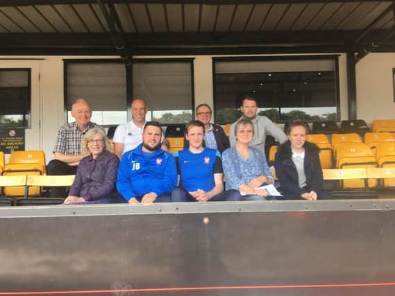 Staff and volunteers from partners of the Sporting Memories Network at Harrogate  Town's grounds.