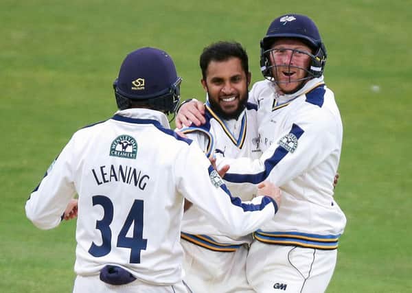 WANTED: Yorkshire's Adil Rashid (centre) is congratulated by Jack Leaning and then captain Andrew Gale after dismissing Lancashire's Kyle Jarvis in July this year. Picture: Alex Whitehead/SWpix.com