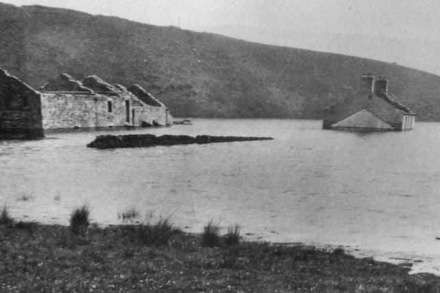 West Houses Farm disappears below the rising waters of Angram Reservoir. (Copyright - David Winpenny)