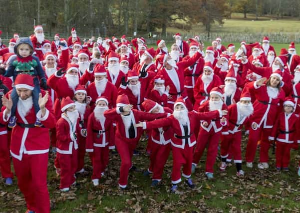 Date:27th November 2016. Picture James Hardisty.
Santa Run in aid of Martin House Hospice held at Stockeld Park, near Wetherby. Pictured Santa's taking part in a mass mannequin challenge.