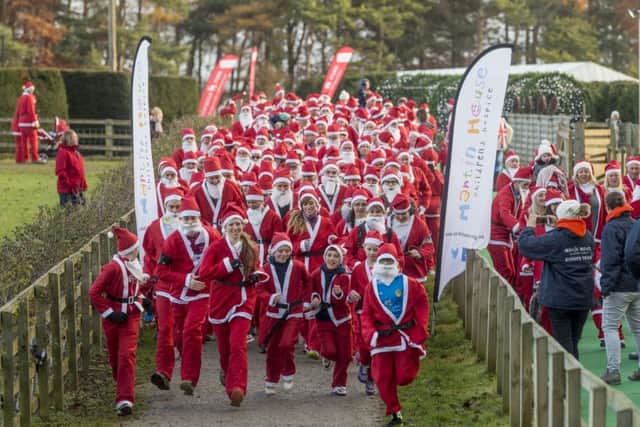 Date:27th November 2016. Picture James Hardisty.
Santa Run in aid of Martin House Hospice held at Stockeld Park, near Wetherby. Pictured Santa's setting off on their 5k run.
