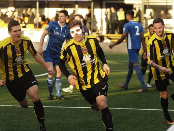 Lloyd Kerry turns in celebration of scoring against Salford City on Saturday. Picture: Adrian Murray