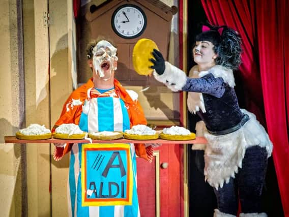A scene from this year's panto Dick Whittington featuring Tim Stedman as Idle Jack and Alice Barrott as the Cat. (Picture by Anthony Robling)