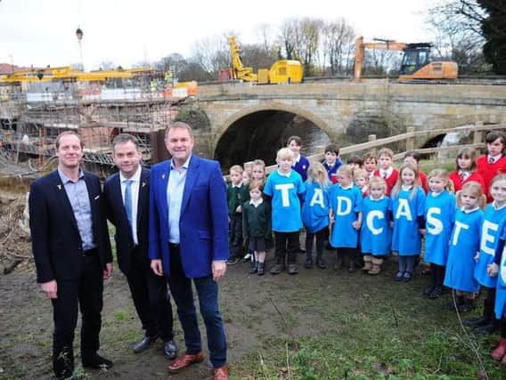Pictured from left, Tour Director Christian Prudhomme, MP Nigel Adams and Sir Gary Verity, Chief Executive of Welcome to Yorkshire were met at Tadcaster bridge by school children from all three primary schools in the town.