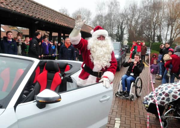 15 December 2015.......      Santa arrives via Leeds Audi  to Martin House Children's Hospice in Boston Spa to deliver Christmas presents from Multiflight at Leeds Bradford Airport.  Picture Tony Johnson