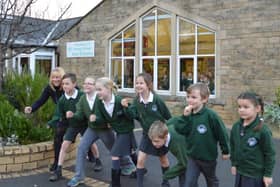 Fountains CE Primary School pupils and headteacher Karen Butler prepare for next years 10k and fun run.