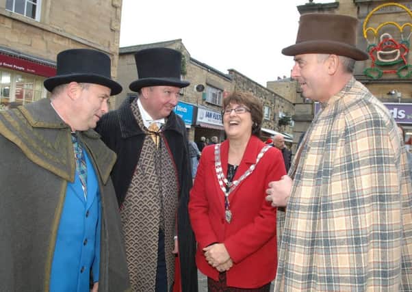 NAWN 1612111AM1 Wetherby Lions Dickensian Market. the Mayor of Wetherby Coun. Norma Harrington shares a joke with Stuart Newcombe, Mark Yelland and Rob Theweneti.(1612111AM1)