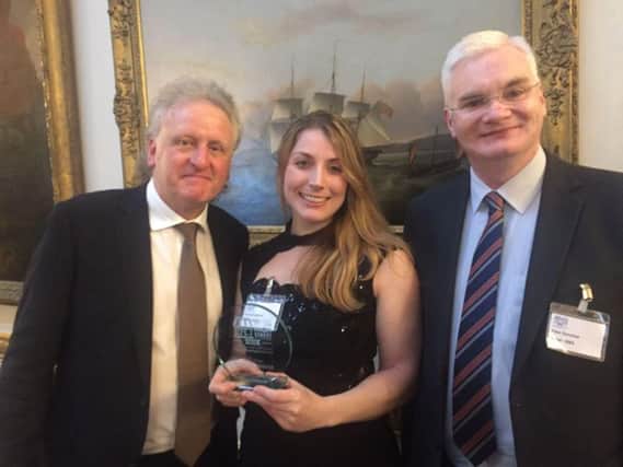 Victory - Patley Bridge's competition bid team members Keith Tordoff and Kirsty Shepherd with Peter Donohoe, one of the judges in the Great British High Street competition.