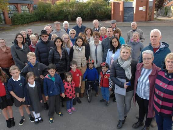 Coun John Ennis, Coun Pat Jones, Olivia Graham and Jane Hill with residents of St Georges Walk.