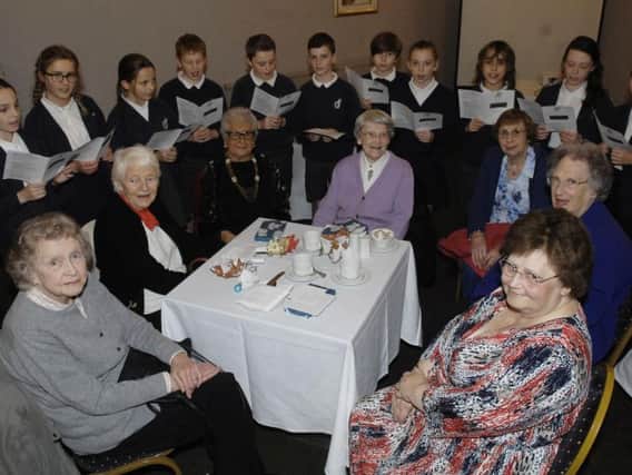 Supporting Older People. Youngsters from St. Roberts Primary School who entertained at the Supporting Older People tea party. .(1612136AM1)