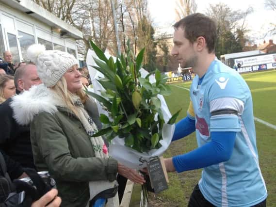 Liversedge captain presents flowers to Sonny's mother, Anna Marie Clarke.