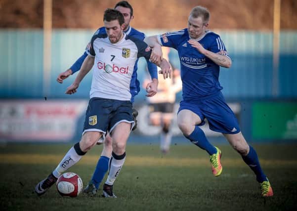 Tadcaster Albion's Rob Youhill in action against Farsley Celtic. Picture: Caught Light Photography