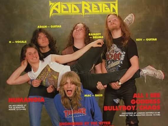 Acid Reign in their 1989 prime with Howard 'H' Smith held sideways by his band mates.