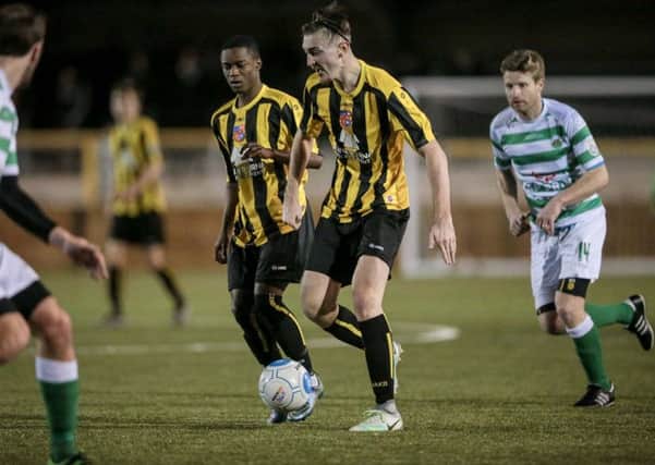 Andrew Higgins and Prince Attakorah in action for Harrogate Town against Bradford Park Avenue on Tuesday evening. Picture: Caught Light Photography