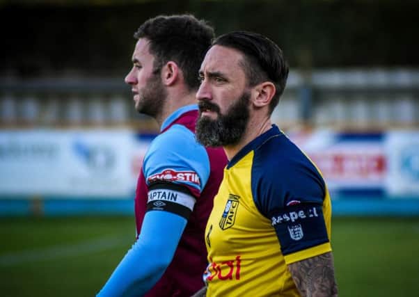 Tadcaster skipper Jono Greening leads his side out against Colwyn Bay but saw red soon afterwards. Picture: Matthew Appleby