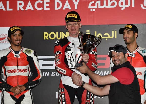 Harrogate's Mike 'Spike' Edwards on the podium after finishing in pole position at the third round of the Bahrain Superbike Championship
