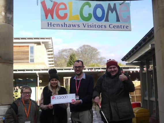 Harrogate's Aliesha Hess, second from left, celebrates her lottery win at Henshaws Arts & Crafts Centre in Knaresborough with David Leedham, art maker; Stewart Graham of Henshaws and Nick Cordier, art maker.