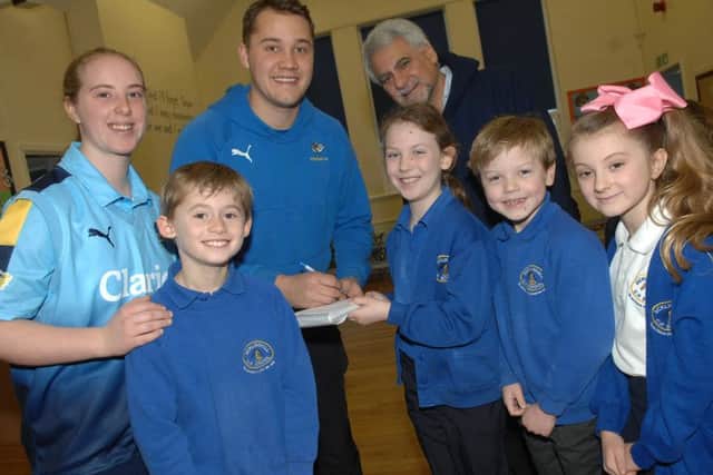 NAWN 1701162AM3 Sicklinghall Primary School Cricket Visit. Callum, Hannah, Sam and Daisy from Sicklinghall Primary School with Katie Thompson (Yorkshire Diamonds Ladies Cricket team), Eliot Callis (Yorkshire CC) and Zai Ali (Sicklinghall CC)(1701162AM3)