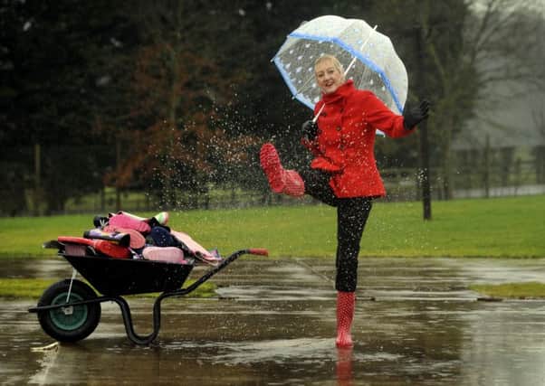 Jane Robinson gets into the spirit of the unwanted wellies appeal for the Harrogate Spring Flower Show.  Picture: Simon Hulme