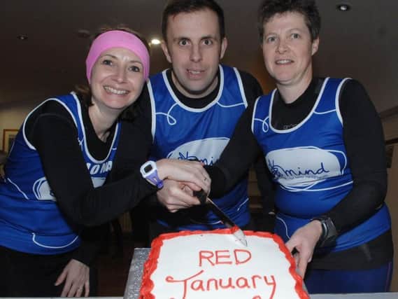Ripon Runners Fiona Hernandez, Andy Purll and Caroline Bentham celebrate their achievement with a cake. (1701316AM2)