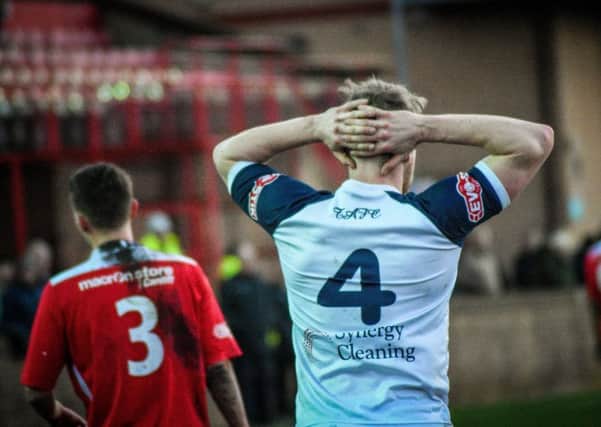 Tadcaster Albion's Josh Barrett is left stunned after his side blew a 3-0 advantage at Droylsden. Picture: Matthew Appleby