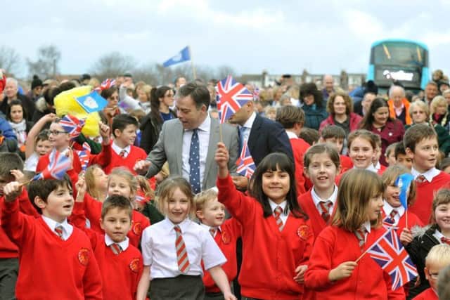 School children from Tadcaster's three primary schools walk in procession with Nigel Adams MP for Selby and Ainsty over the town's re-opened bridge. Picture: Gary Longbottom