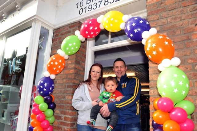 Lisa Stubbs and Andrew Lane with their little boy Zakk (11 months). The family had just opened their business when the floods hit. Picture: Gary Longbottom