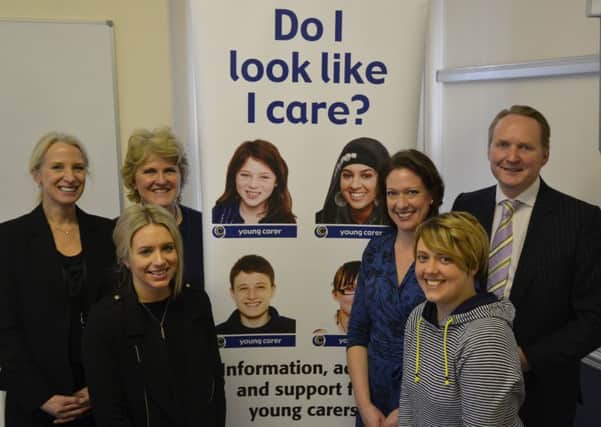 Solicitors Victoria Nott (left) and Jonathan Mortimer (right) with staff and carers at Harrogate Carers Resource.