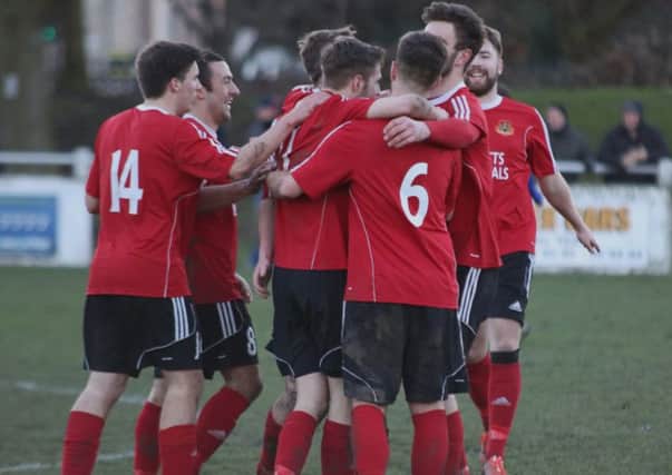 Knaresborough Town's match-winner Paul Atkinson, centre, is congratulated after scoring at Glasshoughton. Picture: Craig Dinsdale