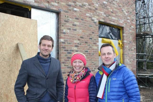 Left to right: Charlie Luxton with Fiona and Nick on the building site of their dream home in Boroughbridge. Picture: Faber & Bishopp PR